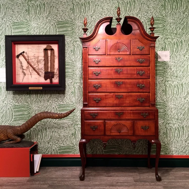 I was immediately drawn to Kelly Kinzle's booth by the patterned green wallpaper and was further interested by the high chest of drawers and the framed sheath and sling.  The carved alligator prevented the scheme from getting too serious!