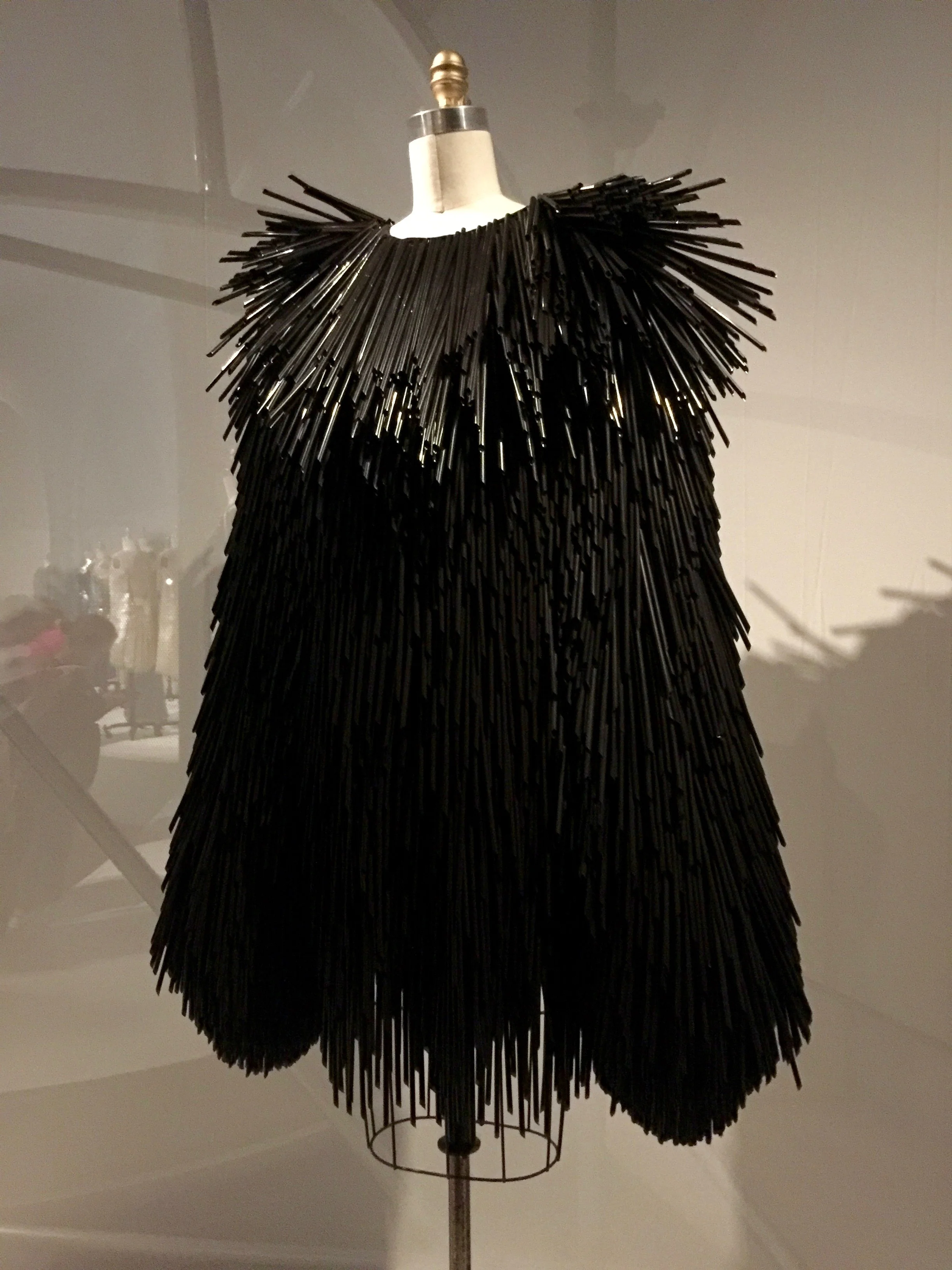 Gareth PughDRESS, pret-a-porter "Every straw was cut by hand...They were attached individually with metal hardware- a little twisted jewelry fitting that hooked onto the fabric base.  On the runway, you could hear them before you saw them.…