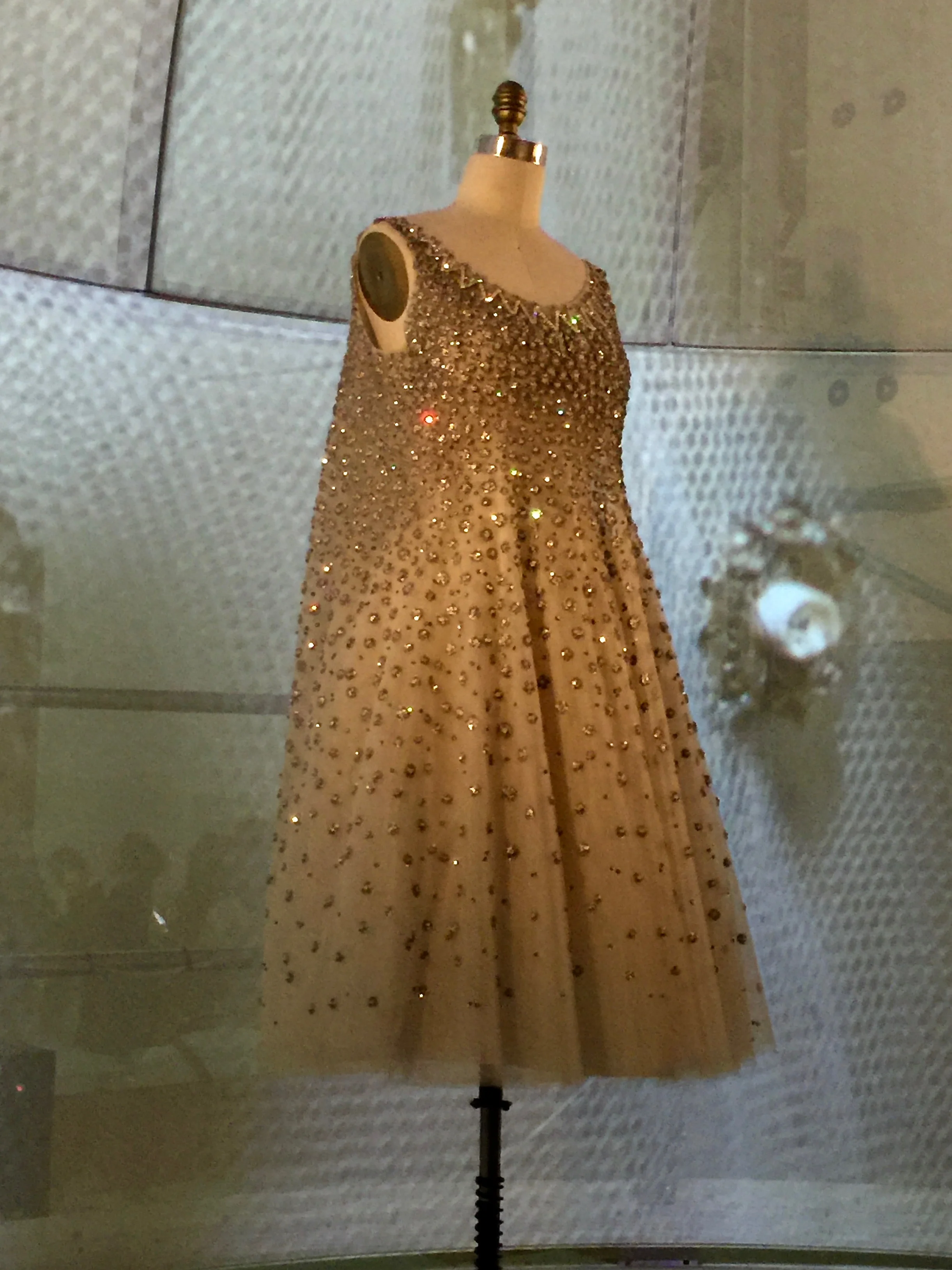 HOUSE OF DIOR, Yves Saint Laurent "L'ELEPHANT BLANC" EVENING DRESS, Spring/Summer 1958, haute couture "All too often, we forget that embroidery is still done by hand, just as it was in the eighteenth century. We can succeed in completely covering a dress with millions of sequins or beads placed one by one by fingers that, especially in our mechanical age, seem as though they come from fairy hands." - Christian Dior