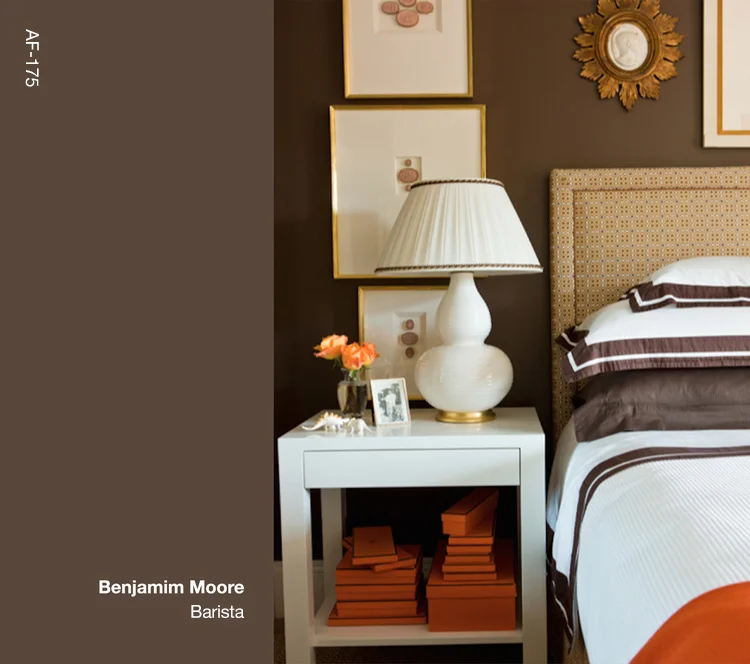 For my bedroom in Beacon Hill I used Barista from Benjamin Moore, a wonderfully saturated brown that added a sense of richness to the space. When using saturated colors, balance is key. In this case, I used simple white nightstands, white lamps with a gold base, and white bed linens with a dark brown trim. To add a bit of "punch", I placed a collection of Hermes boxes on the shelf of the nightstand and an orange cashmere throw at the foot of the bed.