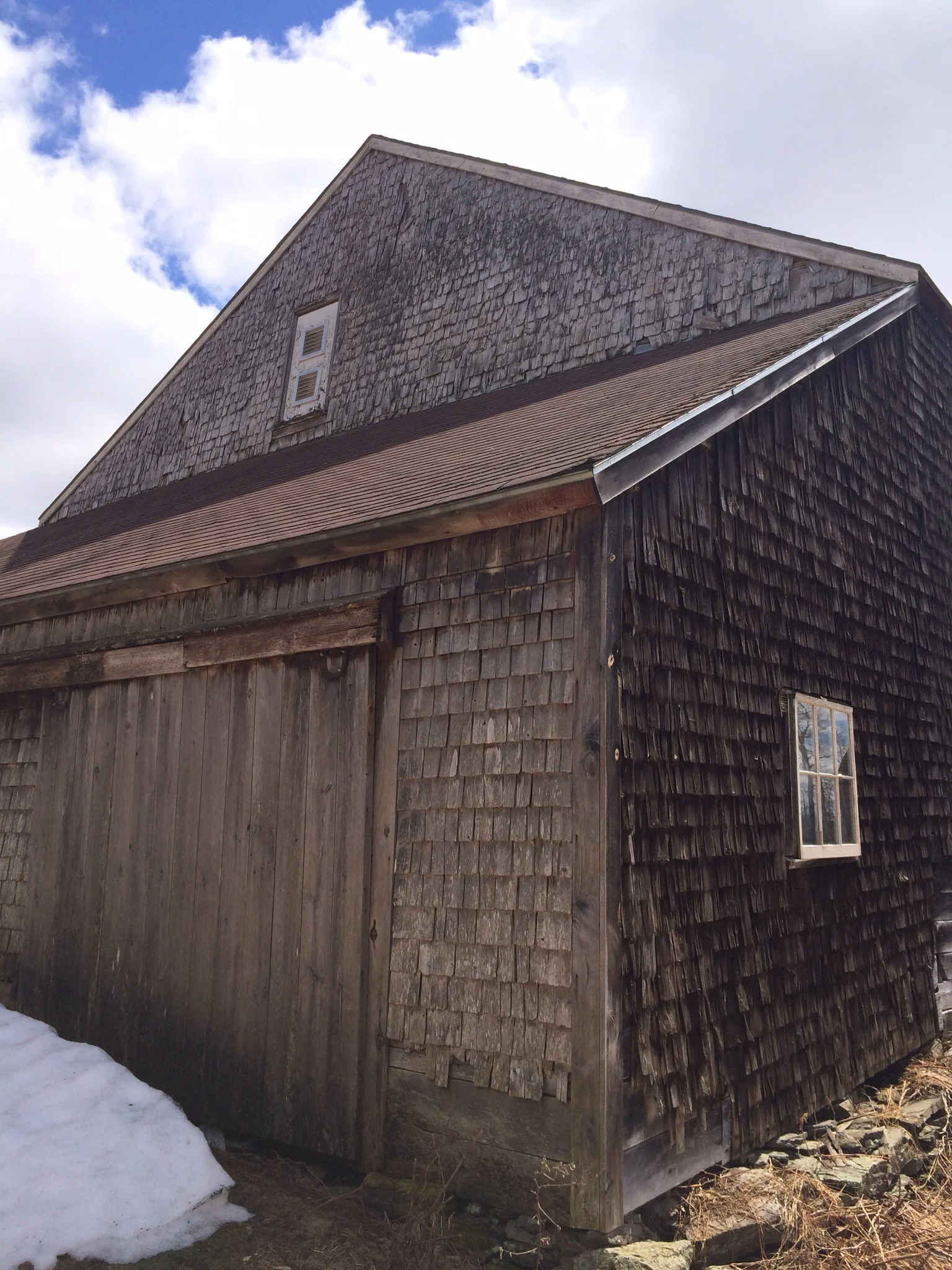 The small bank of snow on the north side of the barn was about all the snow left in the yard and fields by end of day Sunday. 