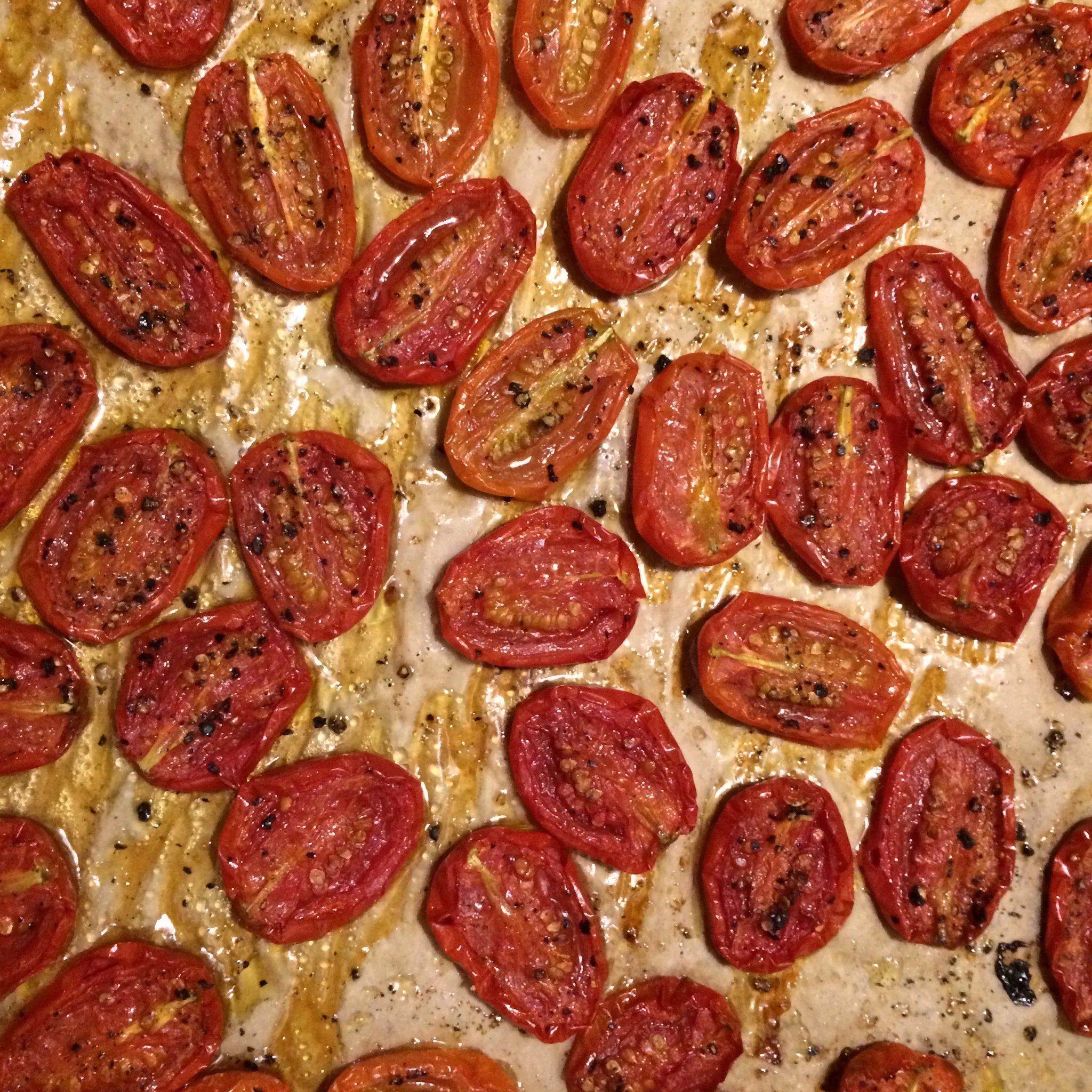 We have little Juliet tomatoes in our garden. I slice them in half, cover with a generous amount of olive oil, salt and pepper, and roast until much of their moisture has cooked off. 