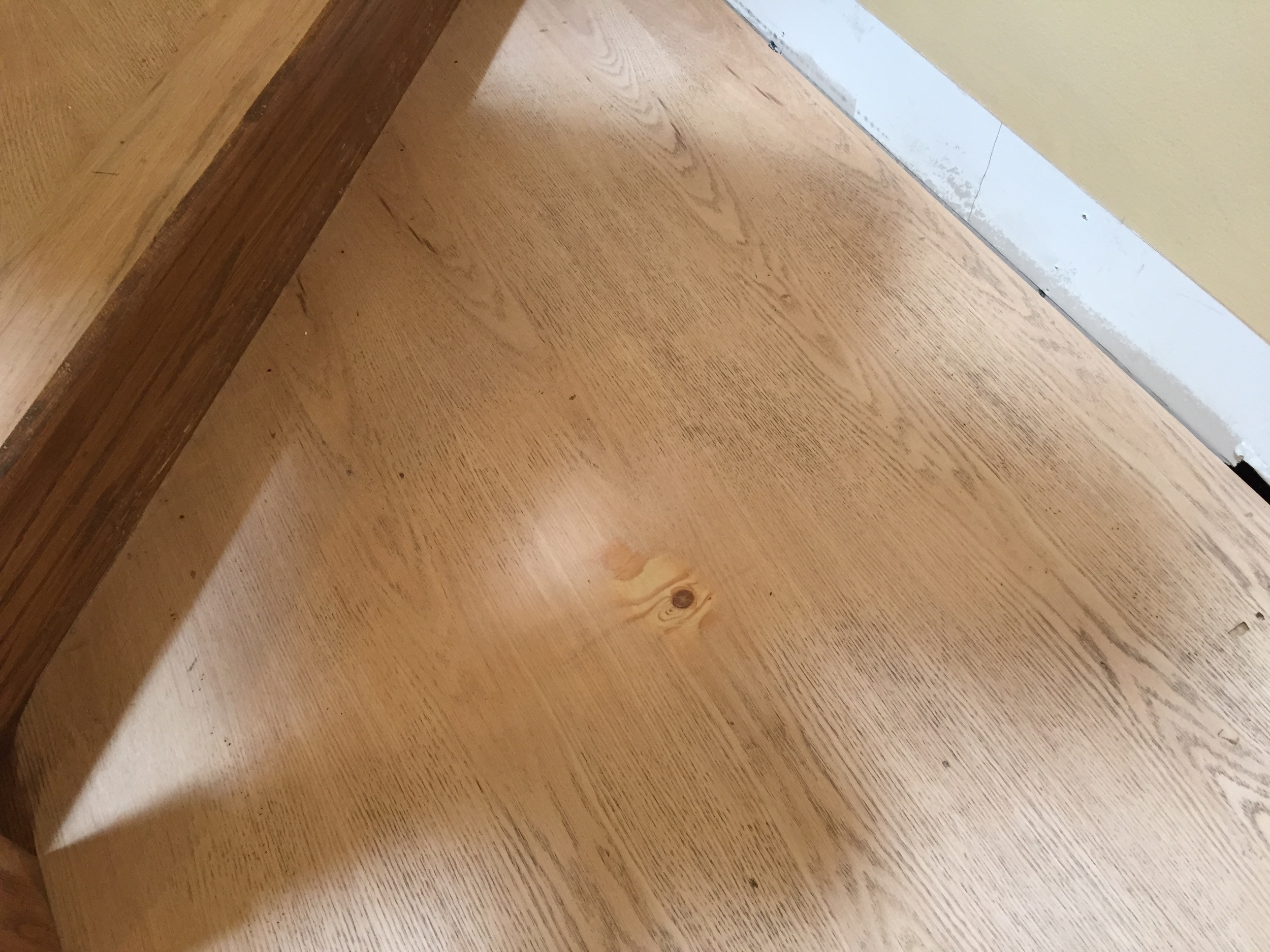 A quick sanding reveals plywood underneath. Not exactly high quality.