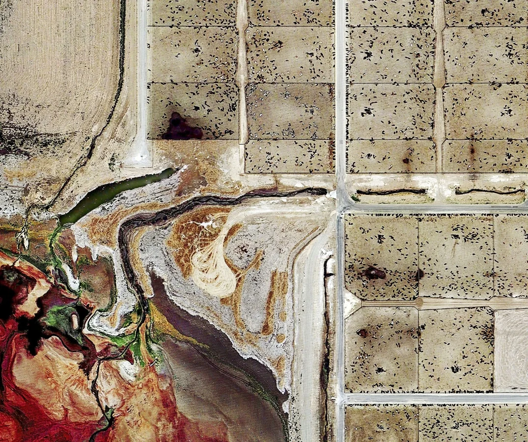 pHOTO detail OF A CATTLE FARM and ITS WASTE runoff into a manure AGOON -DALHART, TEXAS 2013 / BY MISHKA HENNER TITLED "FEEDER"