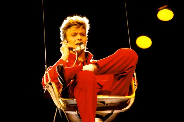 DIALING IT IN: Even one of the coolest men who ever walked the earth sometimes looks a bit of a douche. Mullet hidden out of respect for the lost.