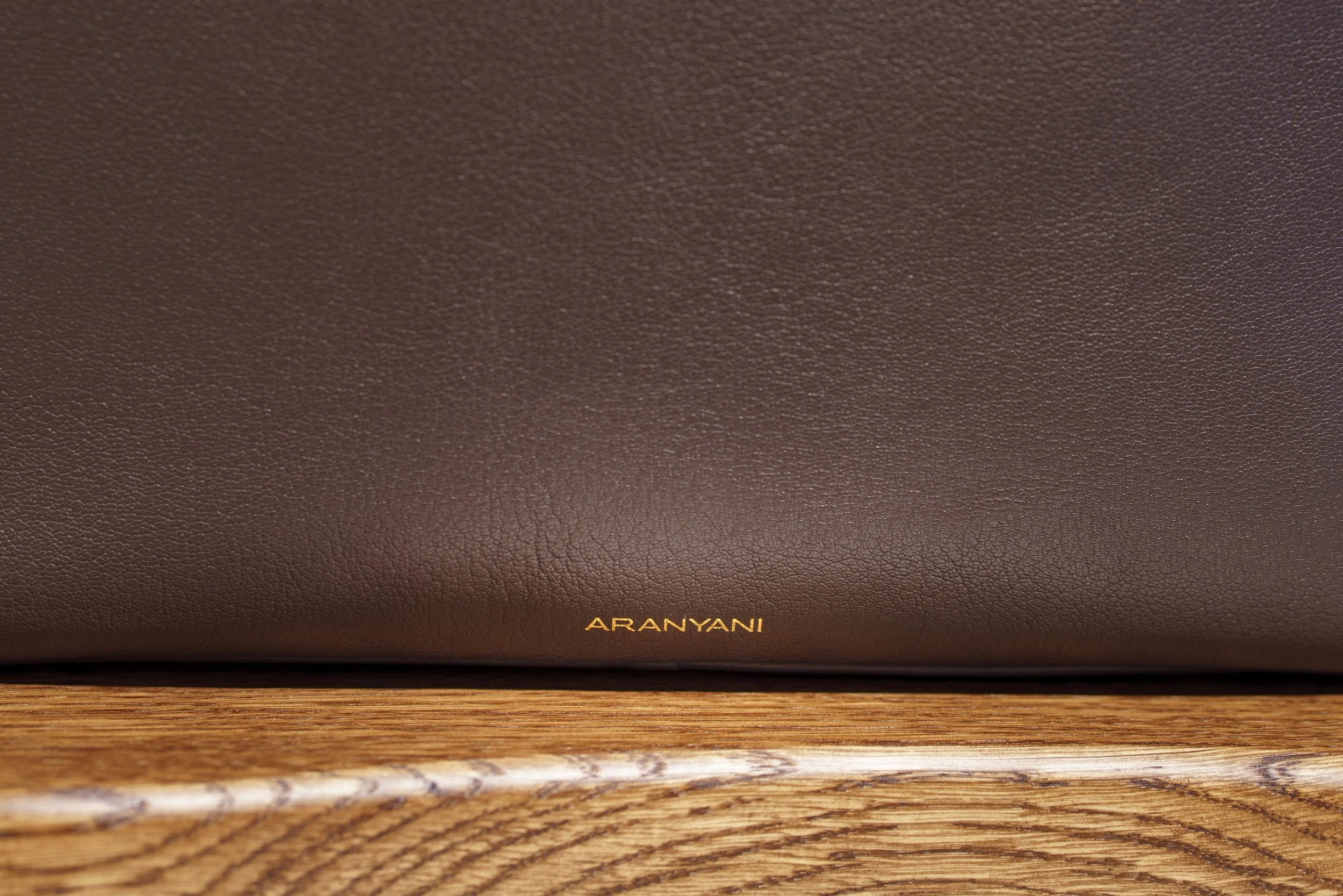 Aranyani luxury retail interior design - terracotta and amber surface detail wide shot
