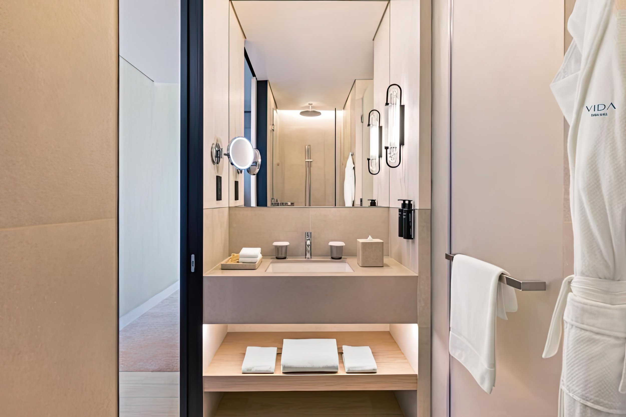 Vida Dubai Mall – Interior Design – luxury hotel bathroom with vanity mirror and designer fixtures – Studio KKD