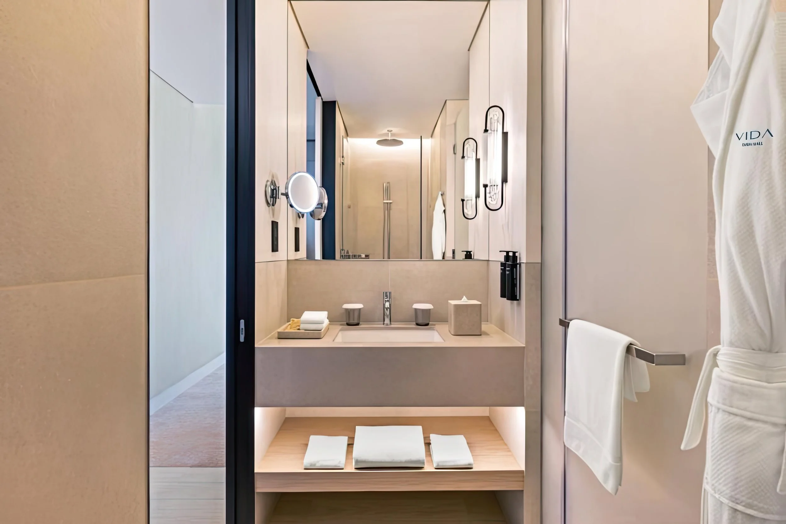 Vida Dubai Mall – Interior Design – luxury hotel bathroom with vanity mirror and designer fixtures – Studio KKD