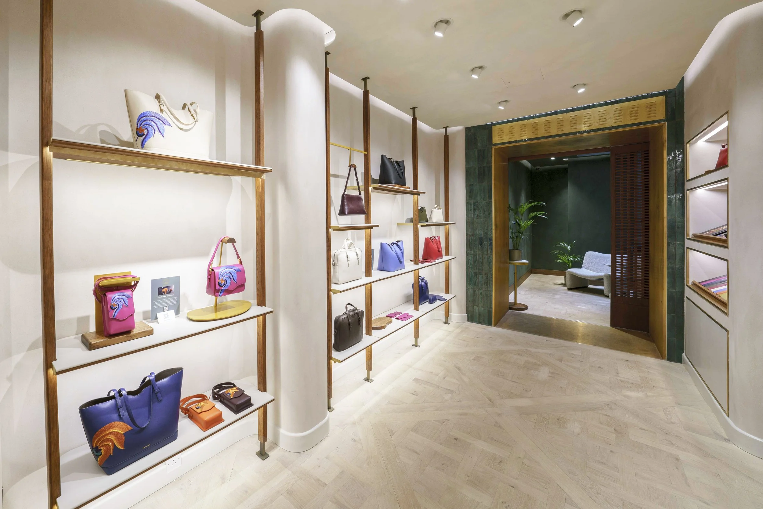 Aranyani luxury retail interior design - ground floor with warm beige walls and dark wood