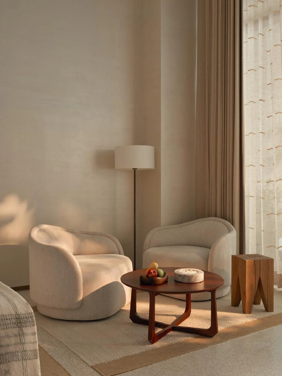 Tulah wellness clinic interior design - suite sitting room with round armchairs and floor lamp