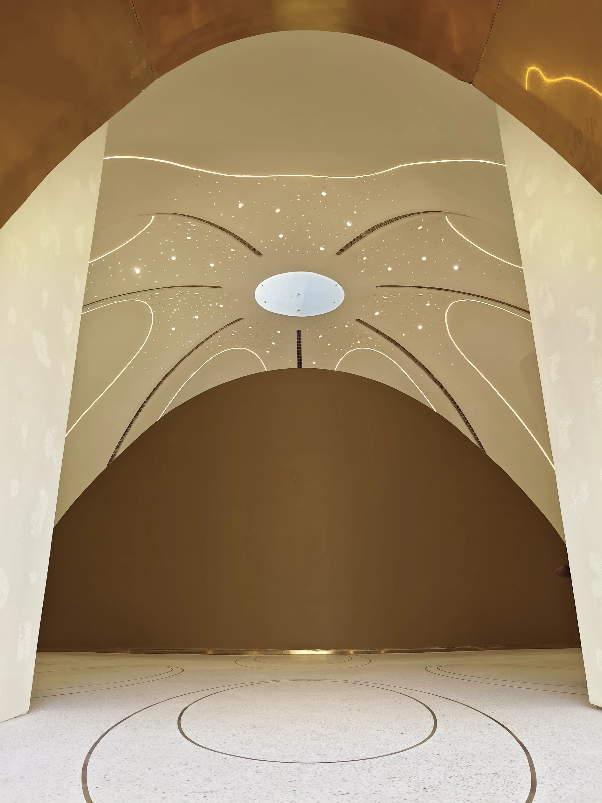Tulah wellness clinic interior design - domed amber ceiling with star lights and oval skylight