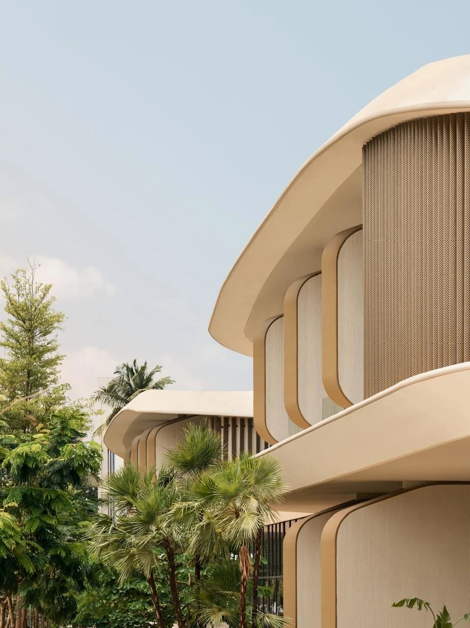 Tulah wellness clinic interior design - curved arched facade with louvre details and tropical palms