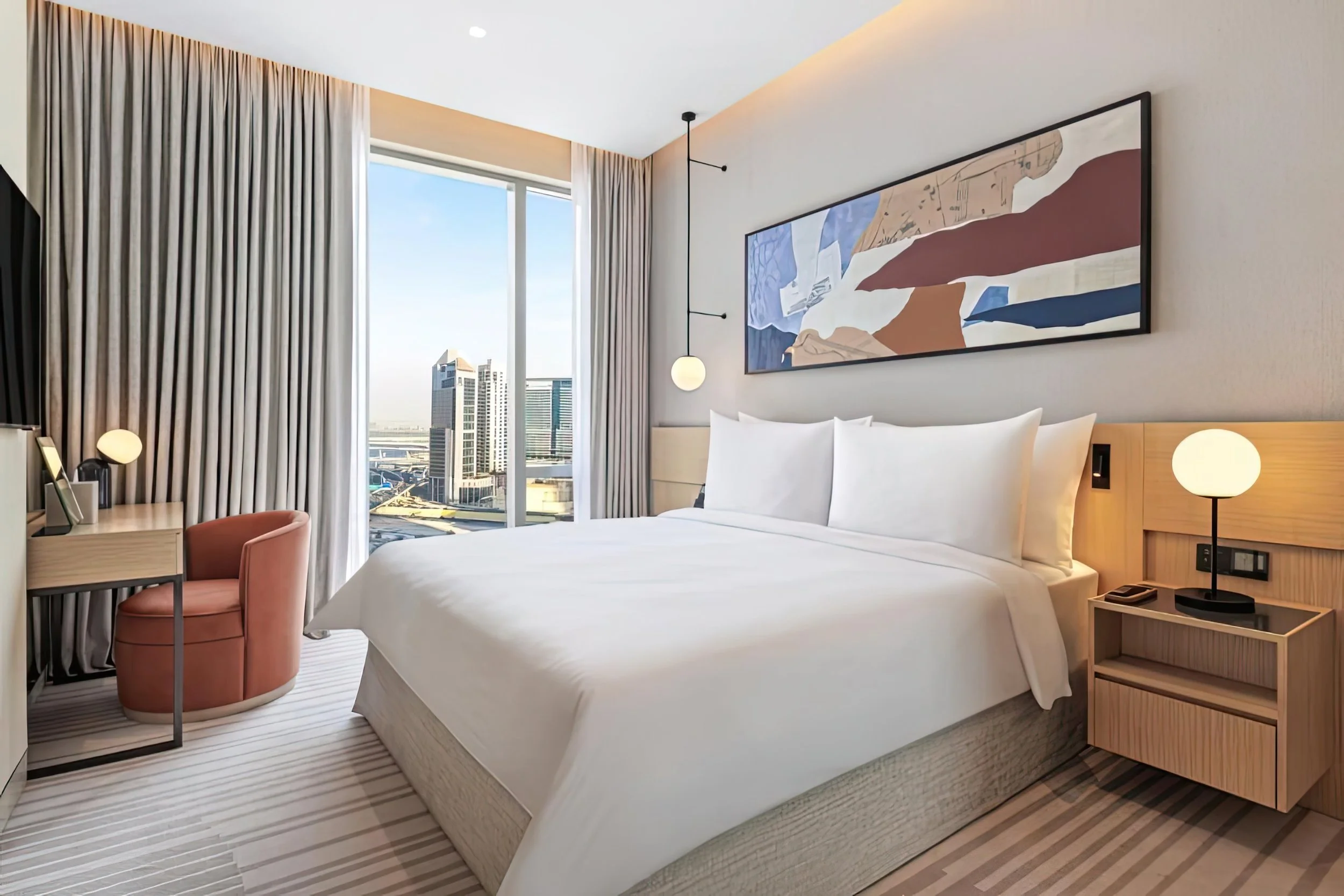 Vida Dubai Mall – Interior Design – hotel bedroom with floor-to-ceiling windows and Dubai skyline view – Studio KKD