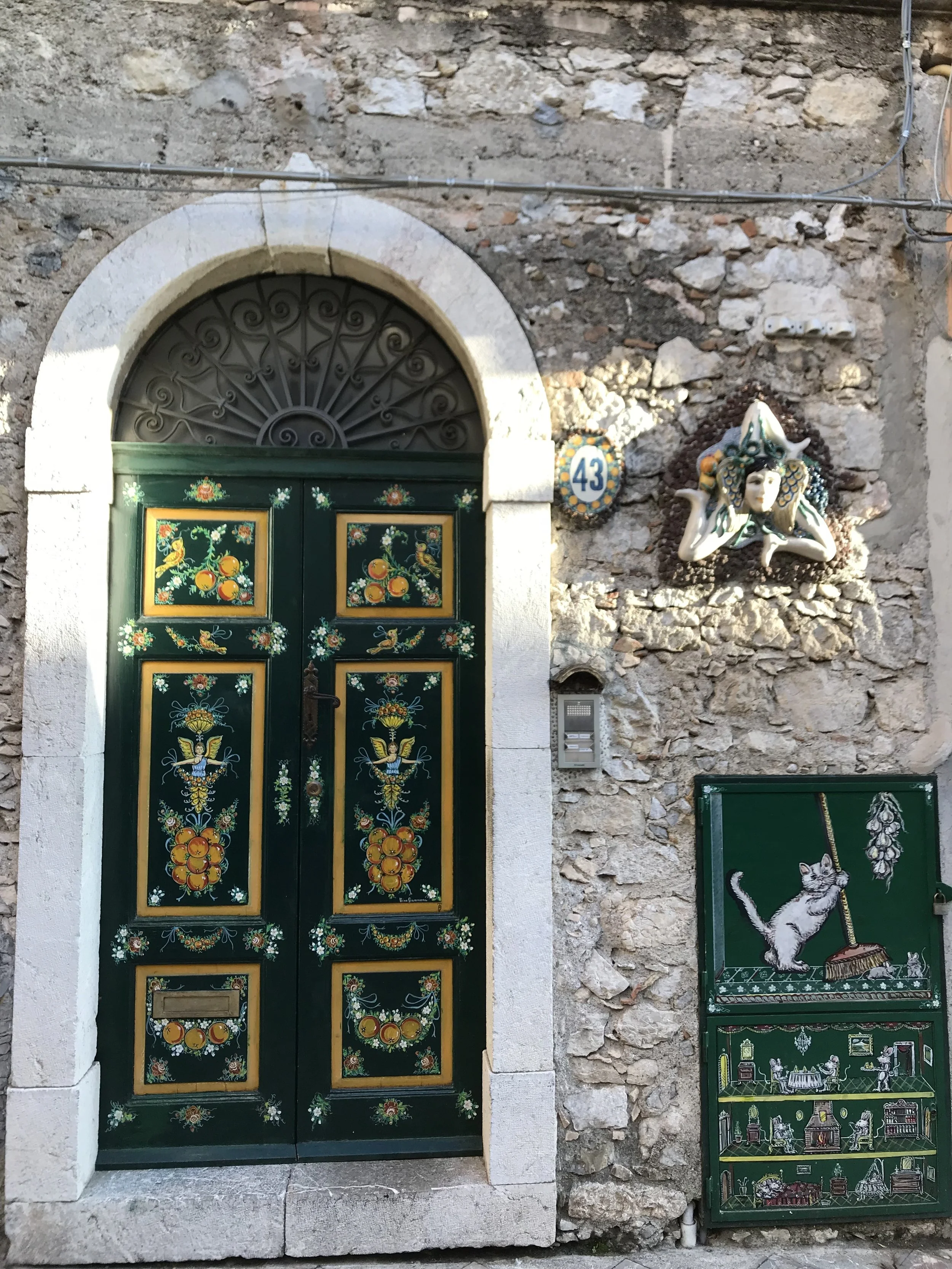  The triangular tile is the symbol of Sicily. The symbol is on their flag, and adorns many homes and shops. We were told a few versions of what the symbol actually means. The common demoninators were agriculture, and the shape of Sicily. The face in 