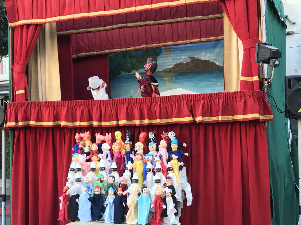  The crowds were lined up for this puppet show. It’s unclear why Marge and Maggie Simpson are included with the rest of the cast of characters.  