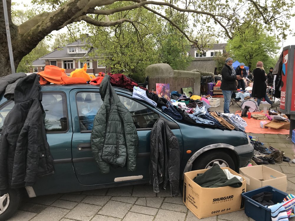  We spent the first part of our last King’s Day browsing through the city-wide street sales. Sometimes it looks like folks just tossed a bunch of stuff from their closet onto the street and put it up for sale. Are those coats for sale? The car? Who k