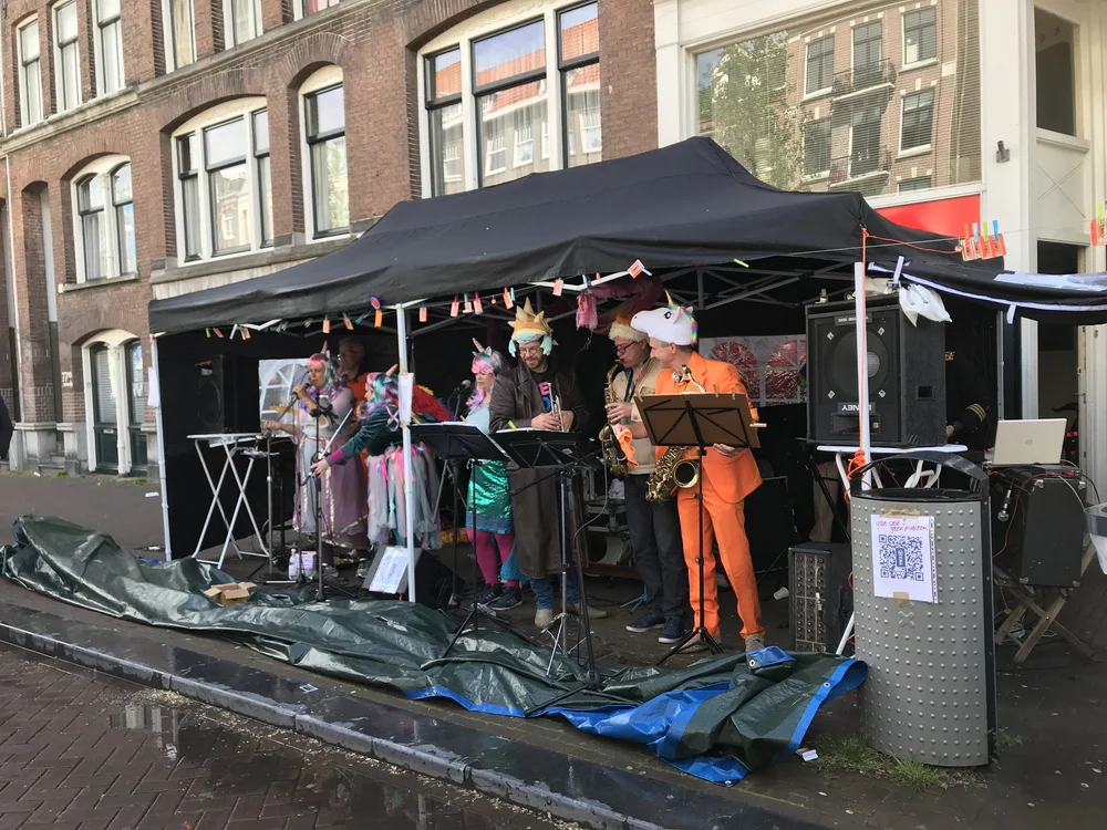  It’s not nearly as cute when adults play their instruments. These hearty souls weren’t going to let a little rain, an inability to carry a tune, or a total lack of rhythm, dampen their King’s Day. 