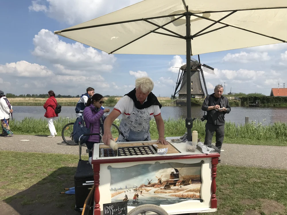  After the long car ride and a walk, this enterprising Dutch man with his  poffertjes , or mini-pancakes, arose like a mirage in the desert.  