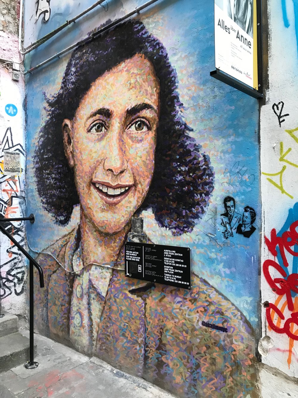  This mural - with a smiling Anne Frank - was painted by a  street artist from London  in conjunction with the  Anne Frank Zenter  in Berlin. 