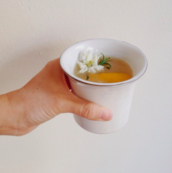 1 splash of orange blossom water + 1.5 oz gin + 1 tbls honey syrup + I slice orange, muddled. Shake with ice, top w/soda water. Pour over ice. Garnished with sprig of baby rosemary + orange peel + jasmine.