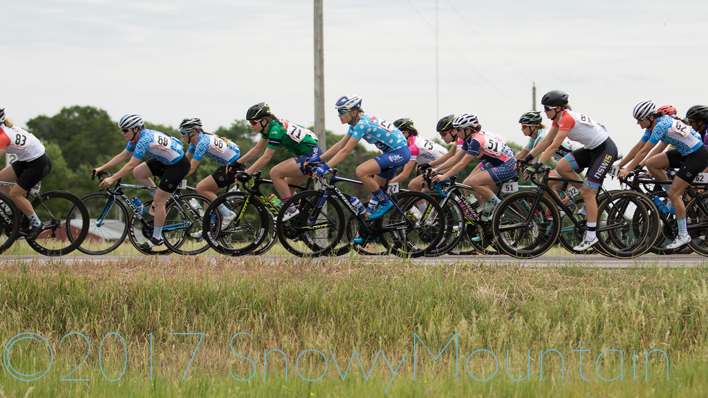 CWEC riders Lauren, Lily, and Heather in the peloton during the North Mankato Road Race 