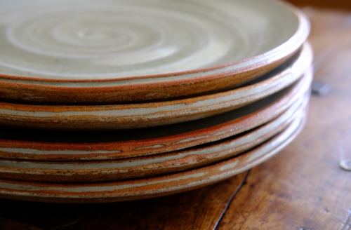 Five plates, 12" dia: white slip; 'eggshell' beach ash glaze.