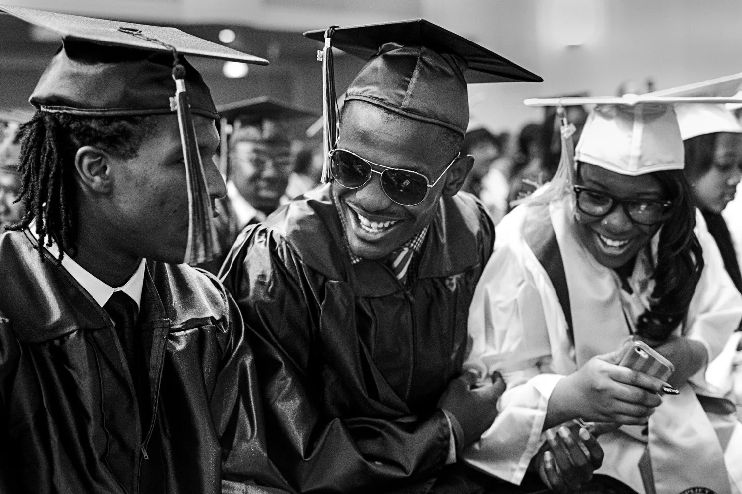 Augustin smiles with his classmates at the 2014 Uplift graduation ceremony.