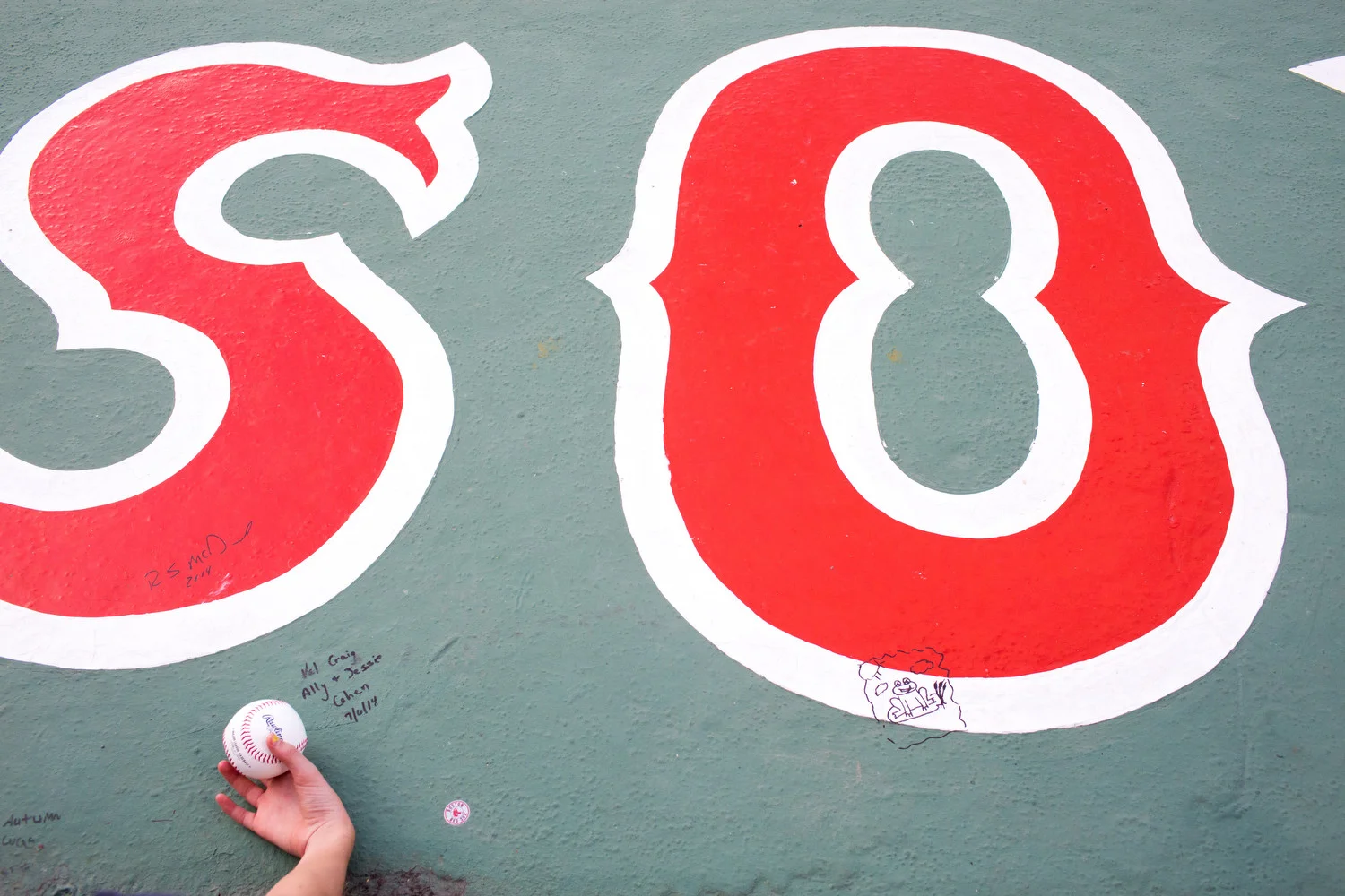 A young fan waits for an autograph at Fenway Park in Boston, MA. 