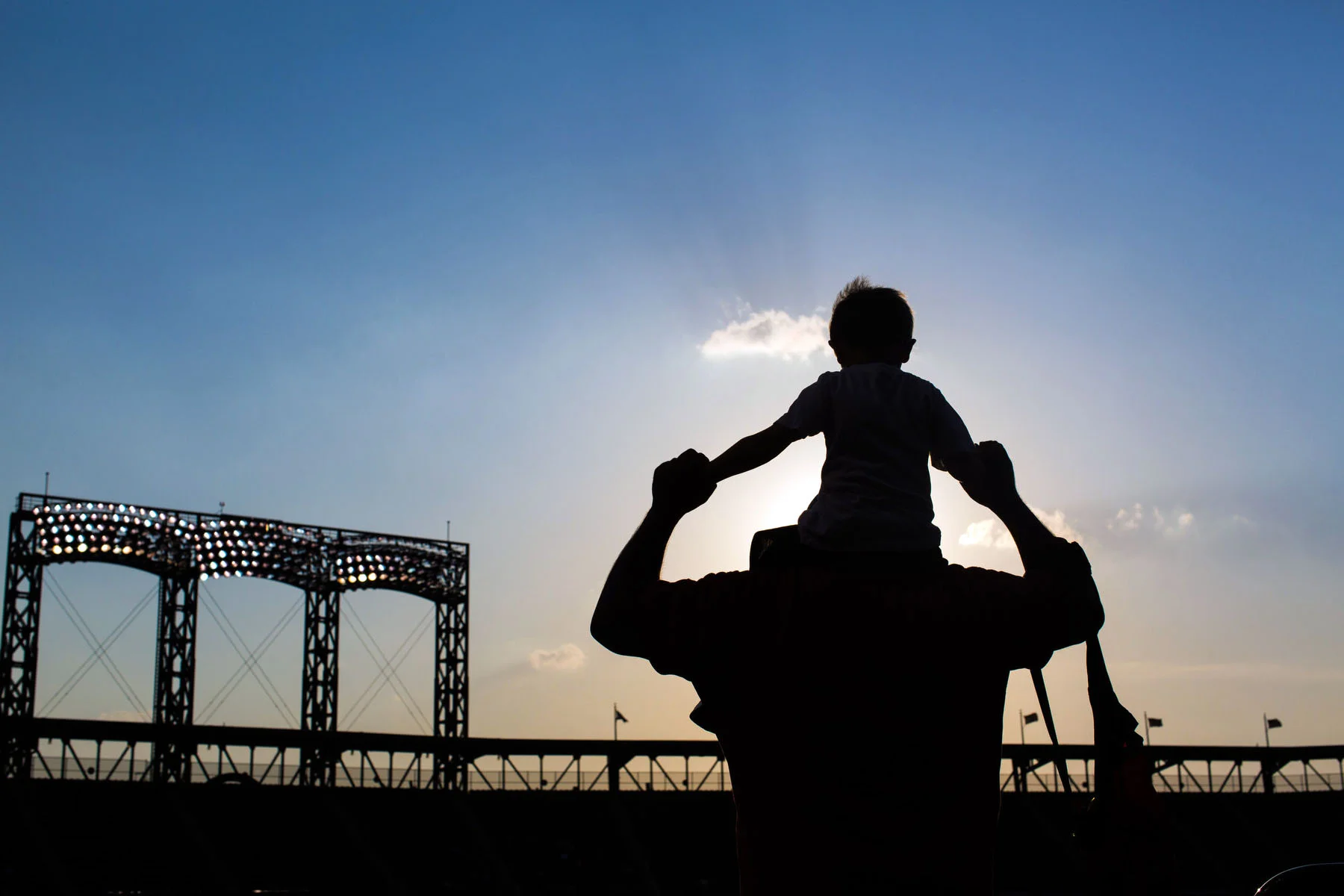Jay holds his son Luca up on his shoulders at Citi Field in New York, NY. 
