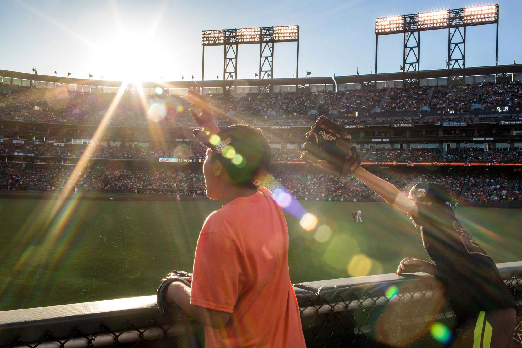 Fans try to get a ball from outfielder Hunter Pence before the start of the game at AT&T Park in San Francisco, CA.