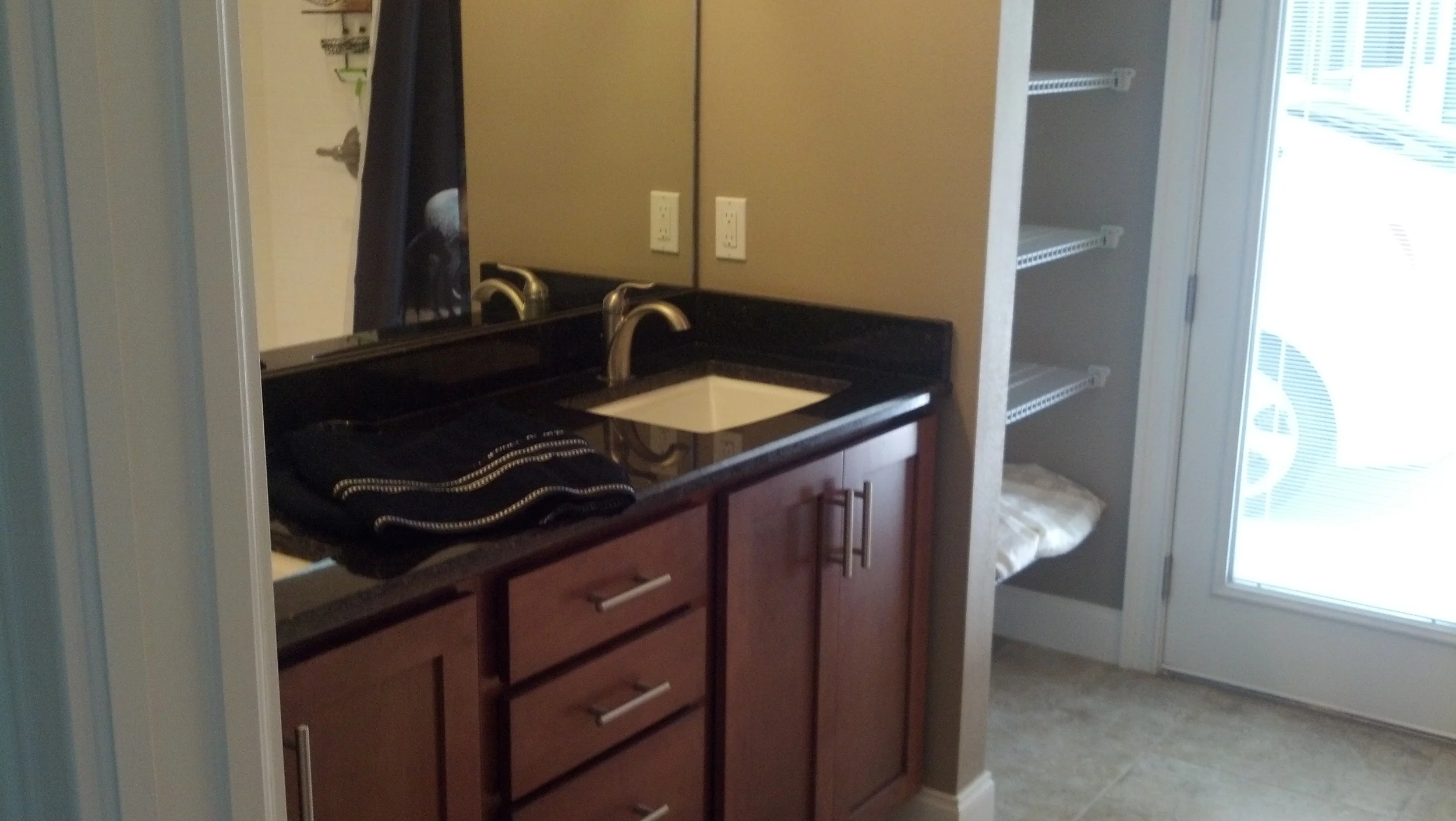 Guest bath with extra large shower, granite counter and dual vanities
