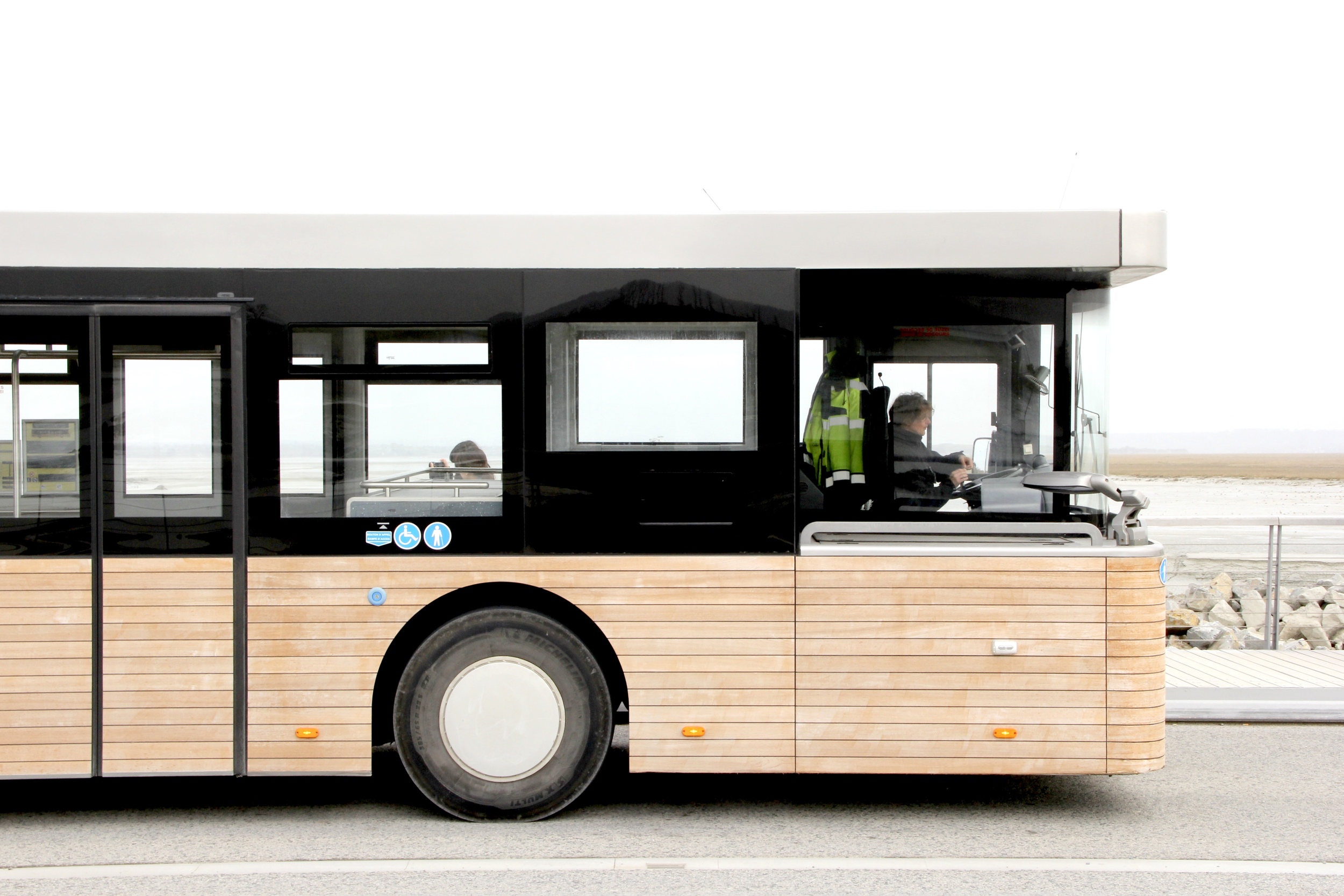 Wood paneled buses at Le Mont St Michel