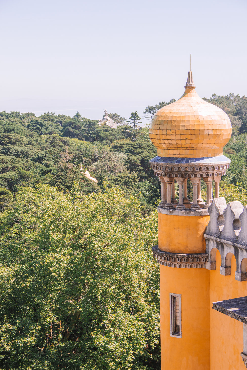 A yellow tower at the palace