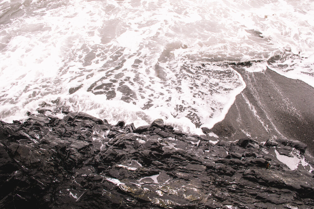 Waves lap our feet at high tide along the Lost Coast Trail