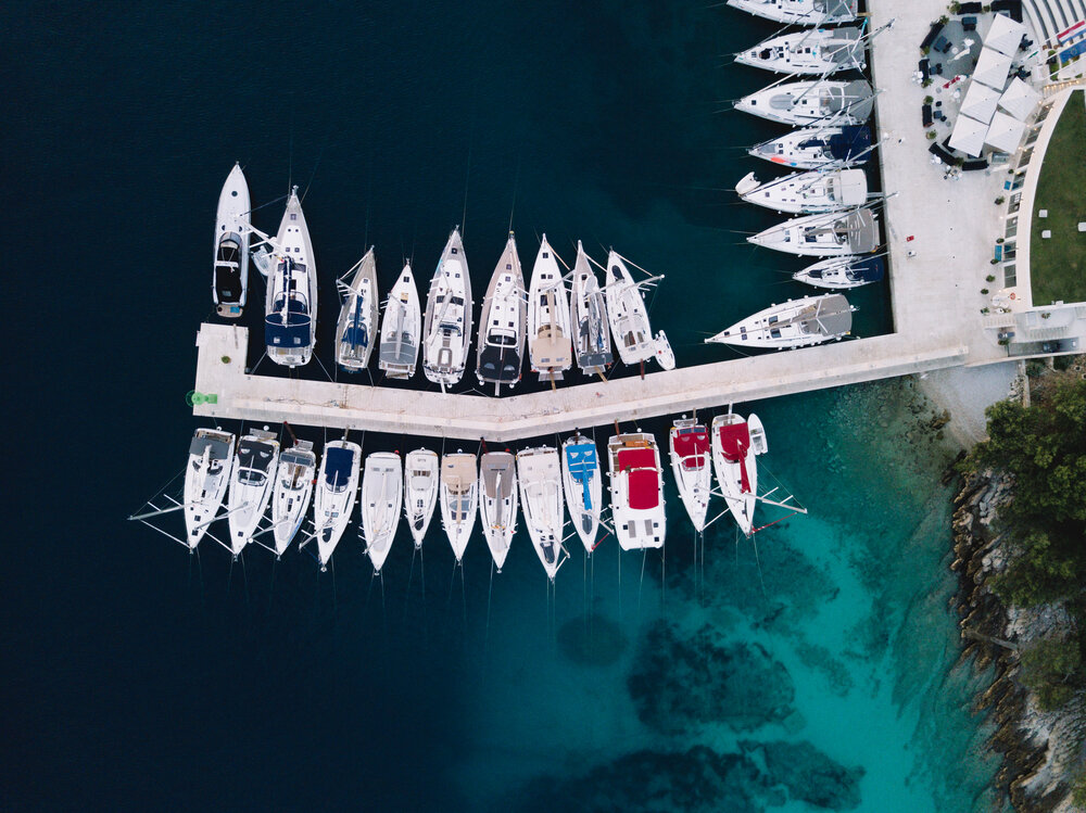 Sailboats lined up at the marina in Solta on Maslinica
