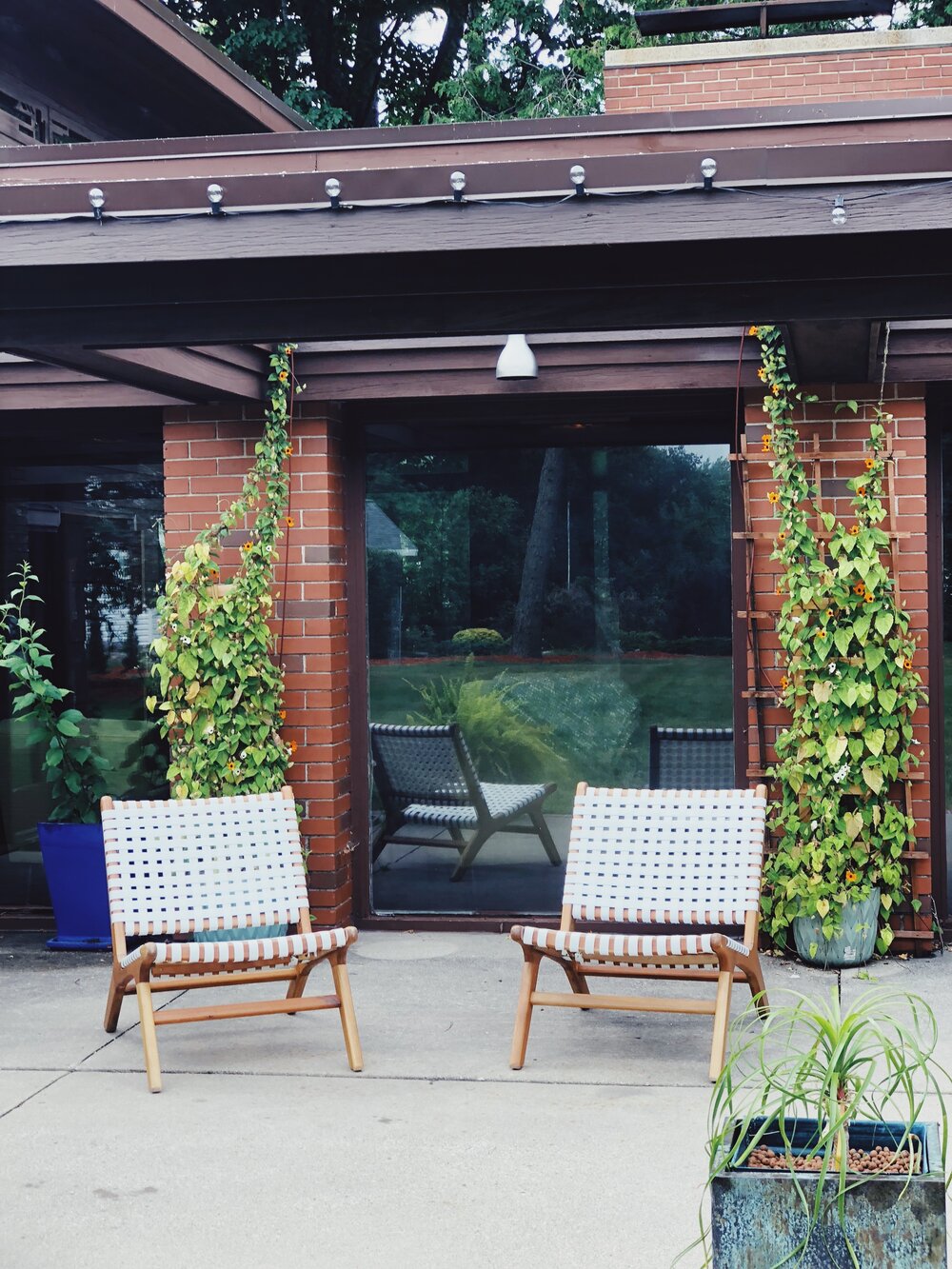 Modern outdoor chairs on the patio of Frank Lloyd Wright House, Still Bend