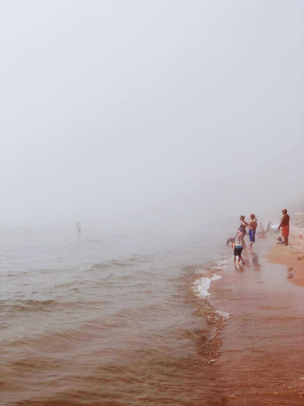 Like a Norman Rockwell painting, hanging at the beach on Lake Michigan mid-summer is quintessential America