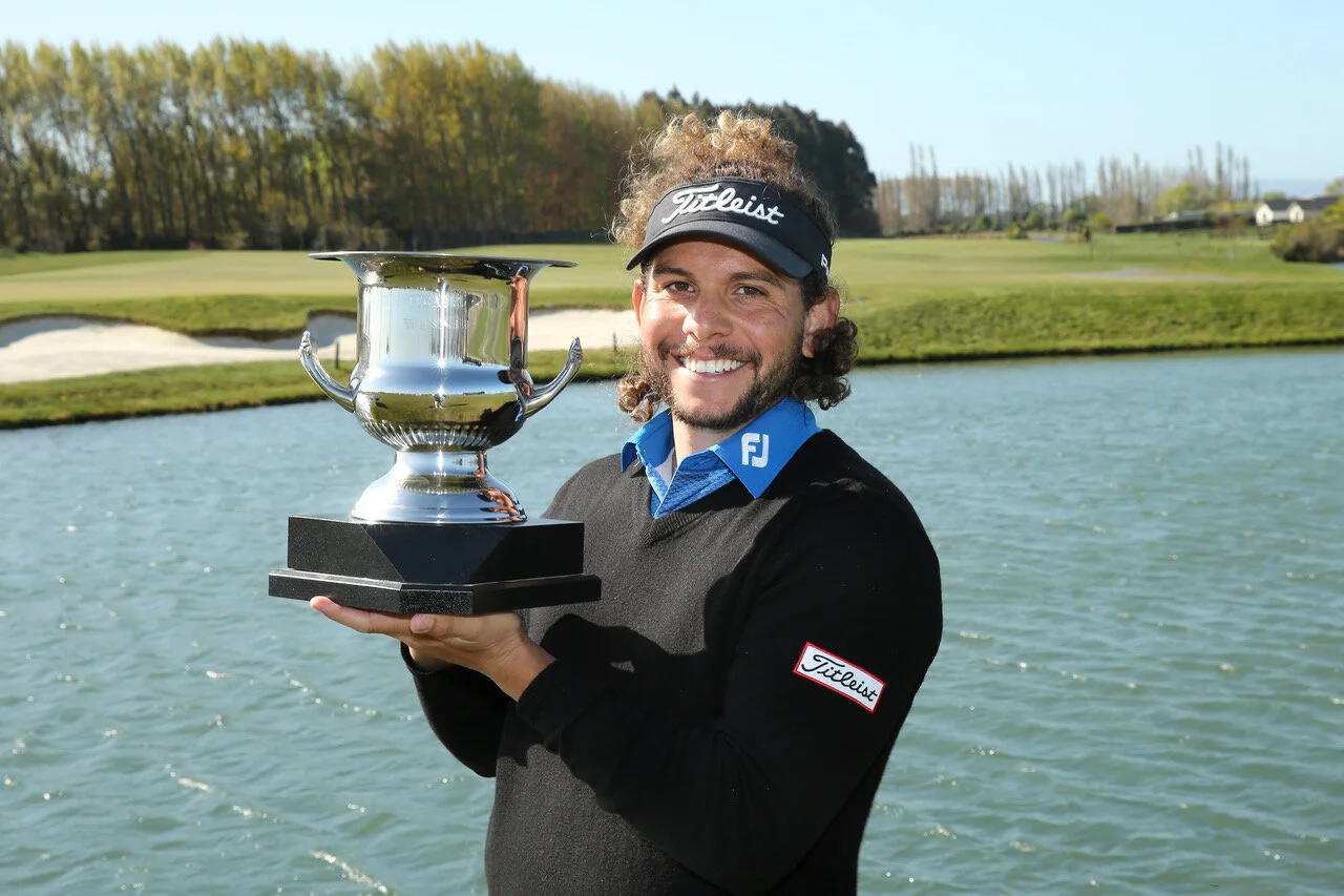 Tauranga golfer Luke Toomey with his trophy after winning the Pegasus Open in North Canterbury. Photo credit: New Zealand Golf.