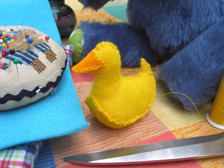  Step 5. Blanketstitch the beak at lucky ducky's head.