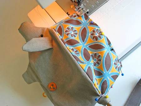 Step 6. Pin and sew together the bottom of the lining. Put the lining in his belly. This piggy is ready to be fed !