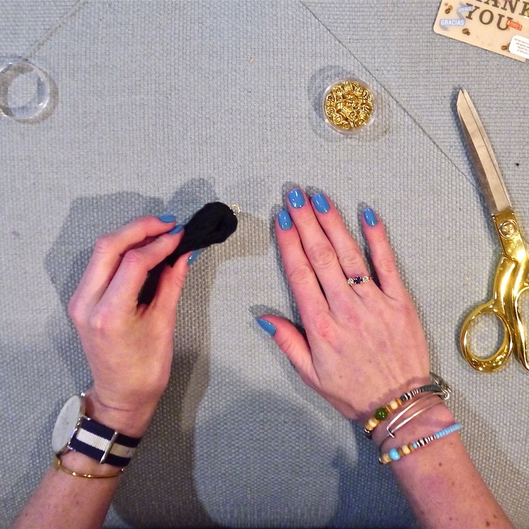 Fold the two sides of the thread together so the jump bead is at the top and you have something that looks like this.