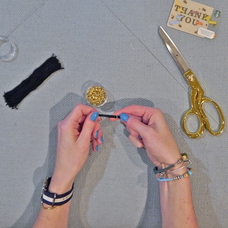  Take the folded thread you set aside and thread it through one of your jump beads.&nbsp; 