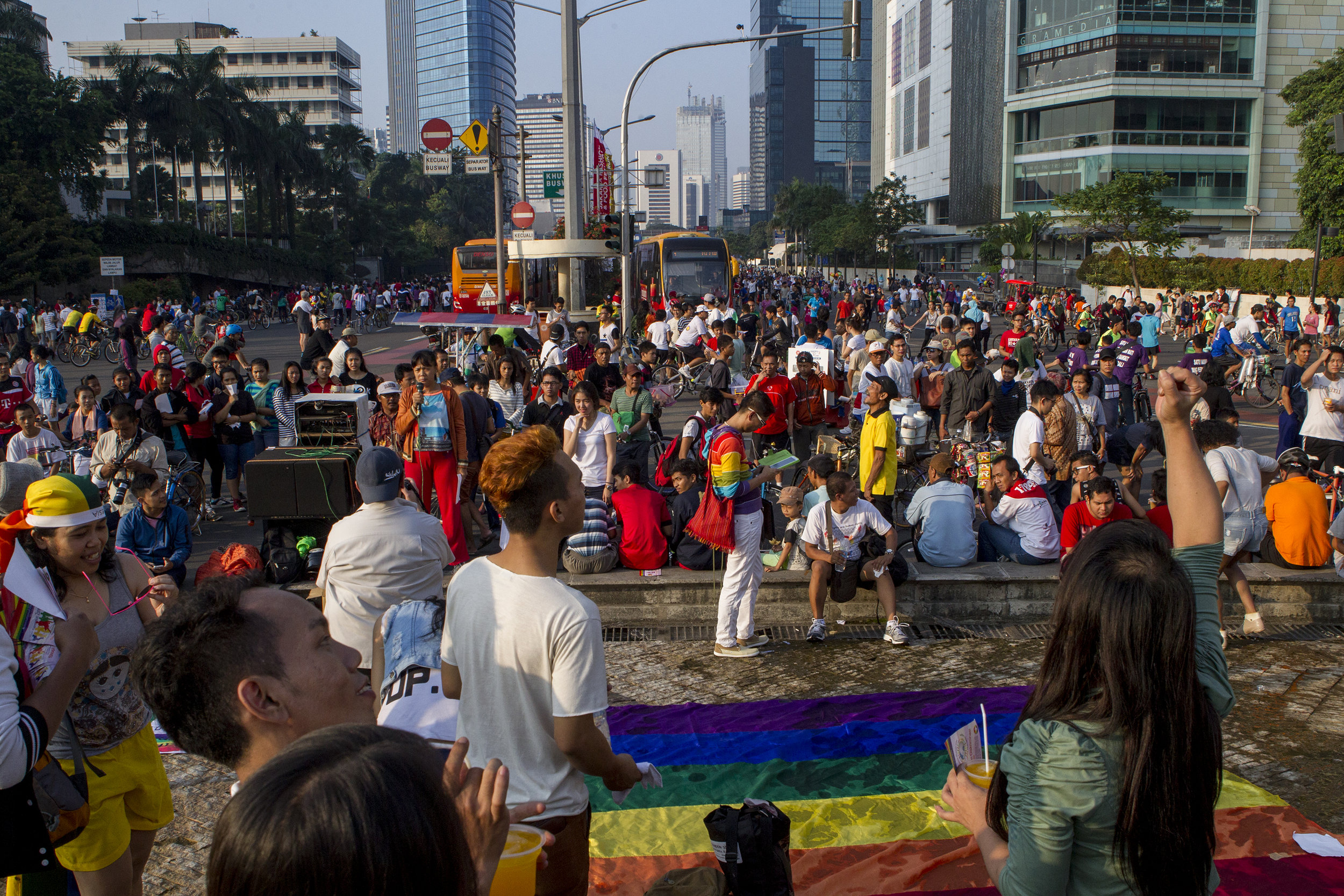 Visibility and recognition of the gay and waria communities in some parts of Indonesia have increased, but there is still a long way to go until they are seen and treated as equal. Caption: An LGTBQ rally in the center of Jakarta. 