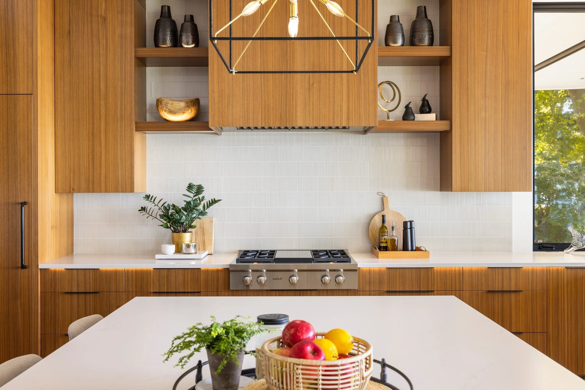 Vertical grain walnut cabinetry, under-counter LED lighting, and our signature Benchmark craftsmanship. 

#benchmarkwoodstudio #benchmarkdesignstudio #walnutcabinetry #modernwalnutkitchen #customwalnutcabinets