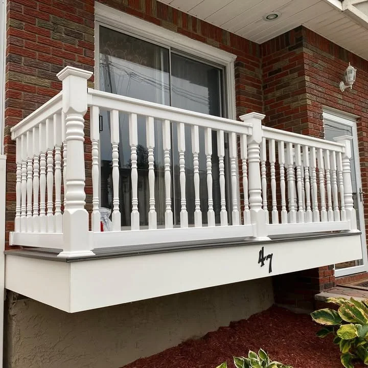 Beautiful porch railing featuring colonial spindles with matching posts and a T-Rail top. Available at Paradise Fence Supply (347) 331-0000 ParadiseFenceSupply.com @ Paradise Fence Supply