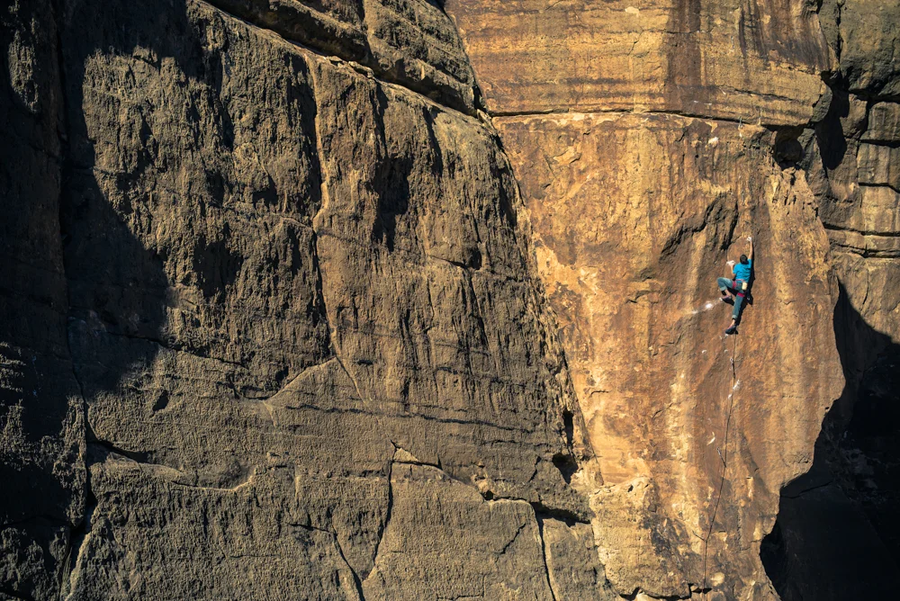 Mike Vaughn rock climbing in the Ditch, Arizona.