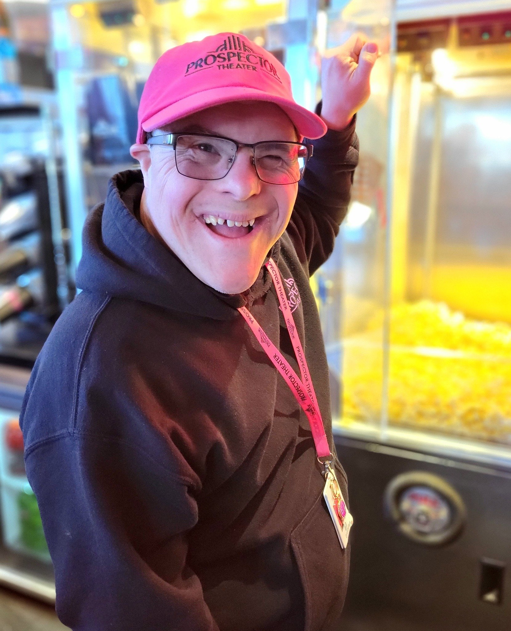 EJ smiles while making popcorn in Concessions