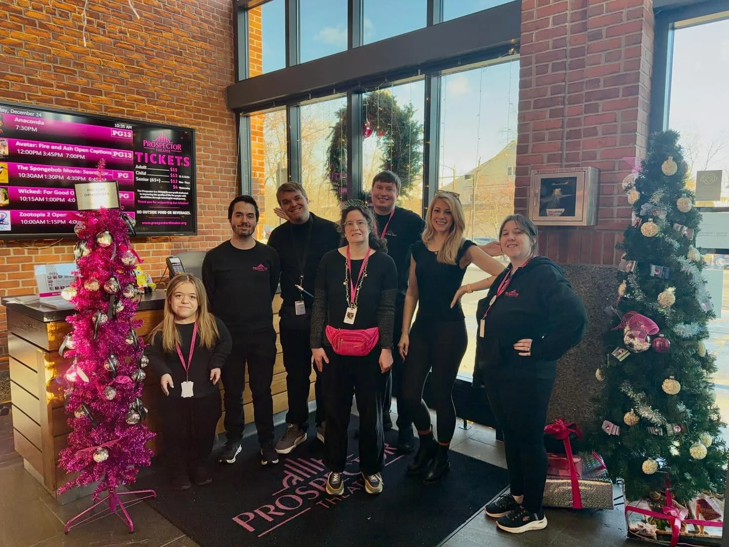 Happy Holidays from The Prospector! 🎁❄️

We&rsquo;re open today and tomorrow. Make sure to grab your tickets. We&rsquo;ll see you soon! ✨
.
.
.
.
Photo Caption: Seven Prospects stand and smile in front of Box Office with holiday gifts and festive de