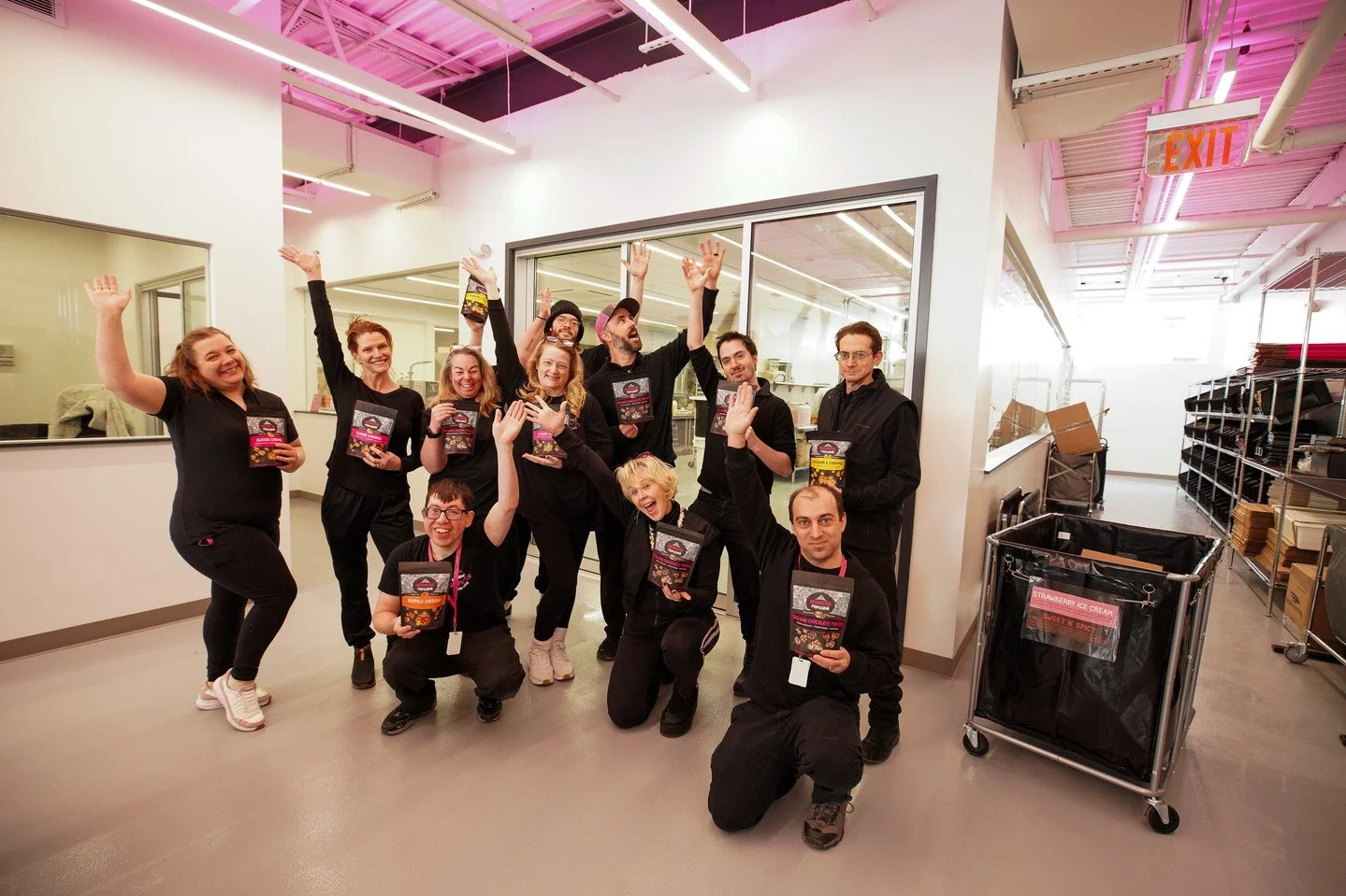 Opening day at the Prospector Popcorn Factory! 💕🌟🍿💙⭐️🧑🏻&zwj;🍳⁠
.⁠
.⁠
.⁠
.⁠
.⁠
Photo Caption: Eleven Prospects cheer and smile while holding bags of Prospector Popcorn. They are in the new Prospector Popcorn Factory, which is filled with sleek,