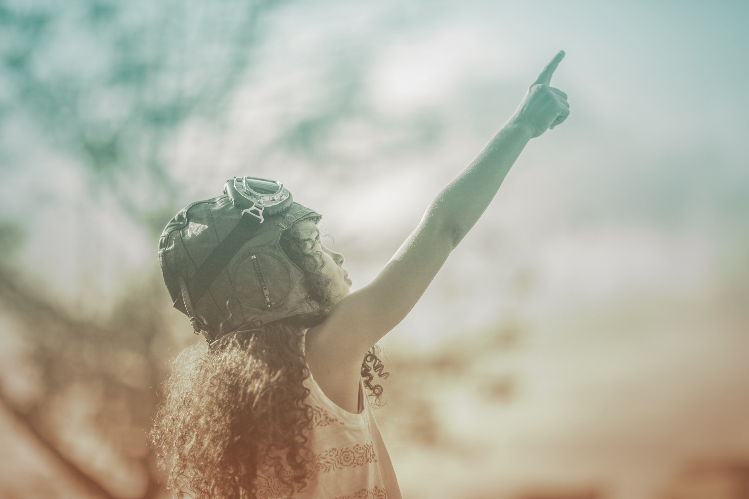 Girl-Pointing-Towards-Sky.jpg